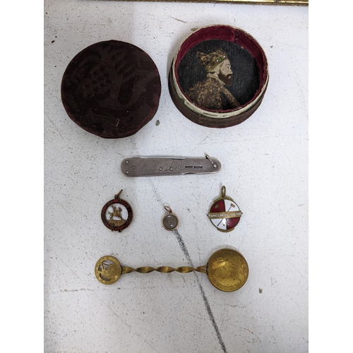 167 - A lot to include two gilt metal Ranelagh polo club enamel badges, 1899 and 1900, a gilded penny coin... 