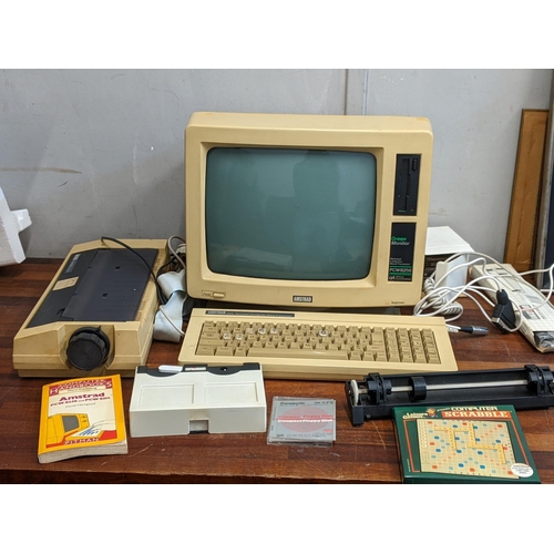 21 - An Amstrad PCW 8256 personal computer with keyboard, monitor printer and accessories in original box... 