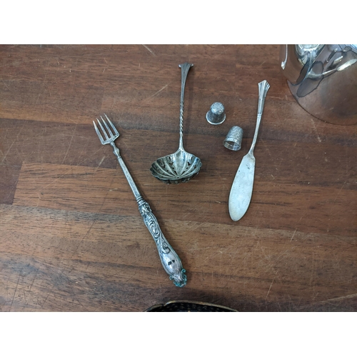 26 - Collectables to include silver comprising a sifter spoon, butter knife, two thimbles 40g, and a weig... 