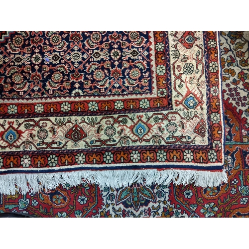 30 - A Persian rug with repeated boteh pelmets, flowers and geometric motifs, 158cm x 220cm
Location: G
I... 