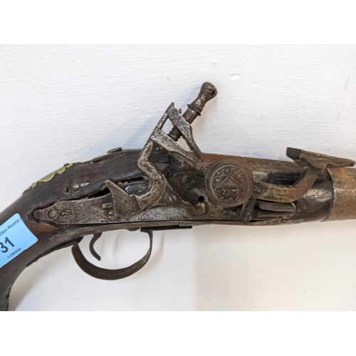 31 - An 18th/19th century flintlock pistol, possibly Indian Location: A2B
If there is no condition report... 