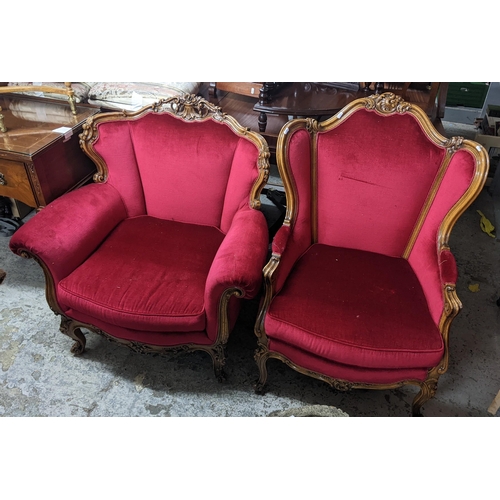 465 - Two mid 20th century Louis XVI style armchairs having floral scroll work frames and on cabriole fron... 