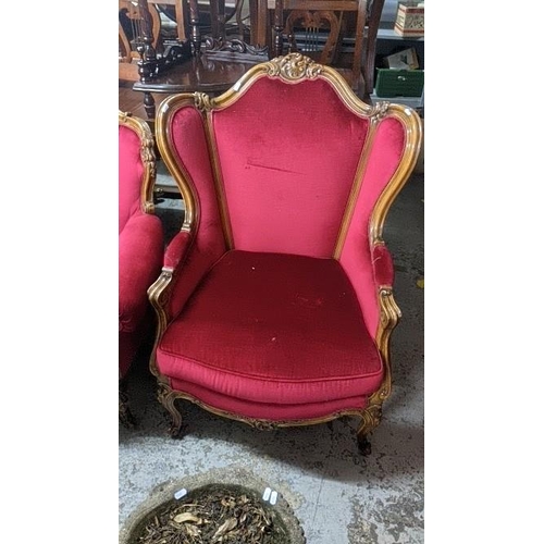 465 - Two mid 20th century Louis XVI style armchairs having floral scroll work frames and on cabriole fron... 