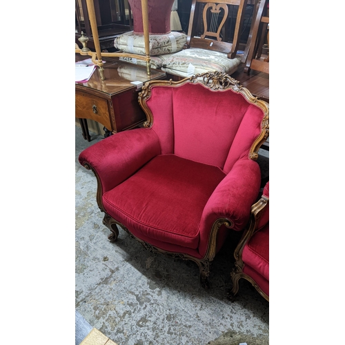 465 - Two mid 20th century Louis XVI style armchairs having floral scroll work frames and on cabriole fron... 