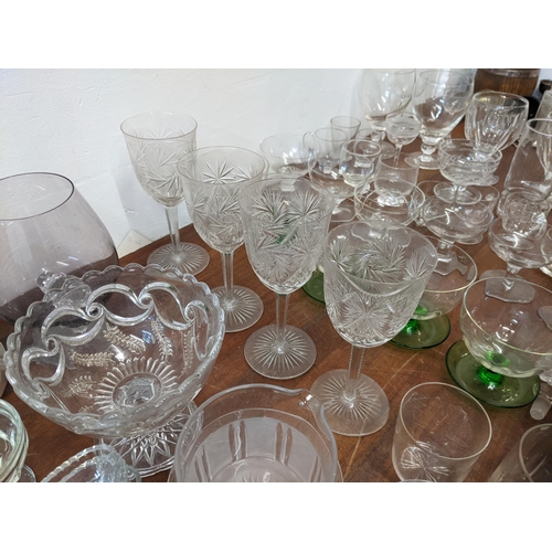 149 - Glassware to include thirteen star cut dishes, a set of four wine glasses, eight rummers, and other ... 