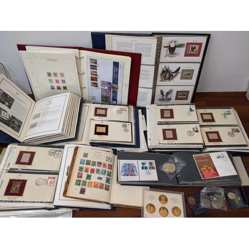 154 - Postage stamps, coins, commemorative coins, five albums of 22ct Golden Replicas of British stamps, a... 