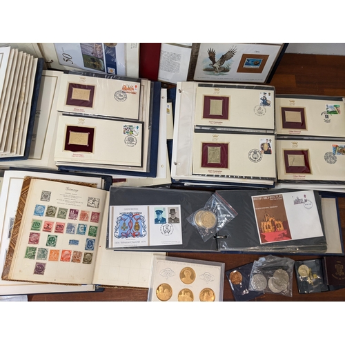 154 - Postage stamps, coins, commemorative coins, five albums of 22ct Golden Replicas of British stamps, a... 