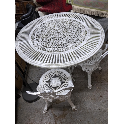 170 - A white painted cast metal garden table, and two garden chairs Location: G
If there is no condition ... 