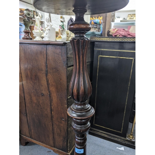 430 - An early 20th century mahogany pot/plant stand with a bordered stand with ovoid tubular and tapering... 