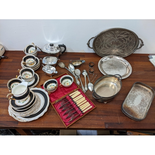 438 - Silver plate to include a tea set, flatware and trays and a bone china tea set Location:G
If there i... 