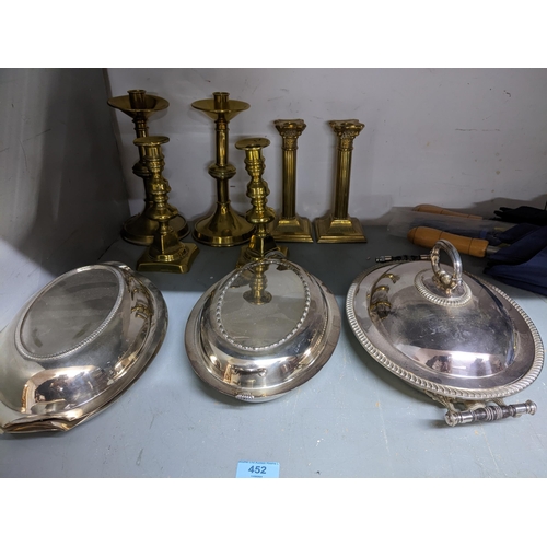 452 - Three pairs of Victorian and later brass candlesticks, a silver plated warming tureen, and two other... 