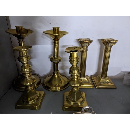 452 - Three pairs of Victorian and later brass candlesticks, a silver plated warming tureen, and two other... 