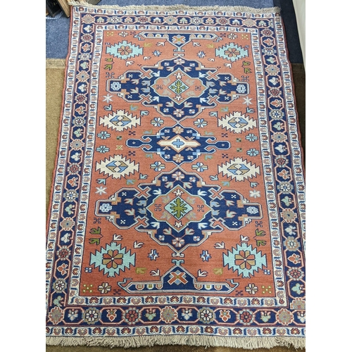 456 - A Turkish rug with geometric motifs on a red ground 167cm x 117cm Location:A2M
If there is no condit... 