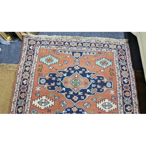 456 - A Turkish rug with geometric motifs on a red ground 167cm x 117cm Location:A2M
If there is no condit... 