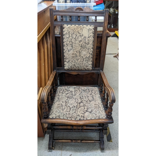 470 - A group of three American rocking chairs with upholstered seats, backs and armrests Location:FOYER
I... 