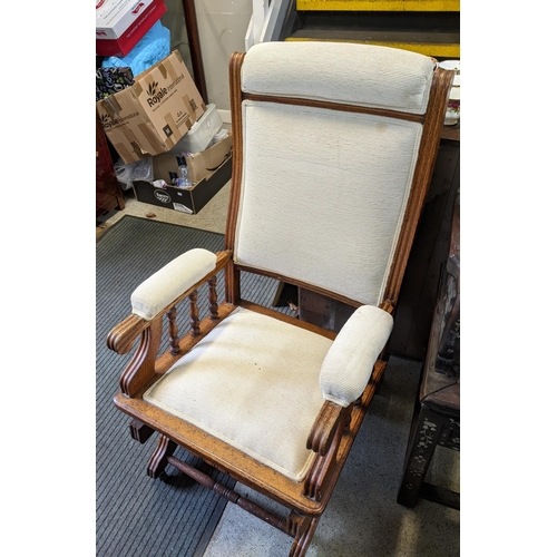 470 - A group of three American rocking chairs with upholstered seats, backs and armrests Location:FOYER
I... 