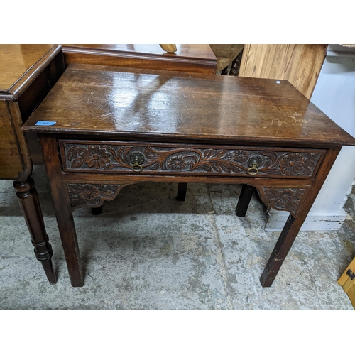 473 - A 19th century oak side table, single frieze drawer with carved decoration, carved spandrels below, ... 