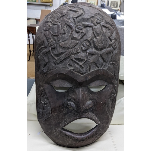 166 - A large African treen trial carved mask, 77h x 45w
Location: A1B
If there is no condition report sho... 