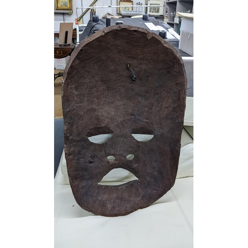 166 - A large African treen trial carved mask, 77h x 45w
Location: A1B
If there is no condition report sho... 