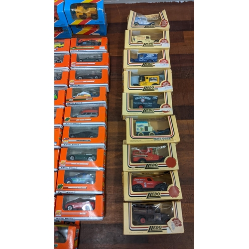 392 - A collection of boxed and unboxed diecast vehicles to include on example commemorating Prince Andrew... 