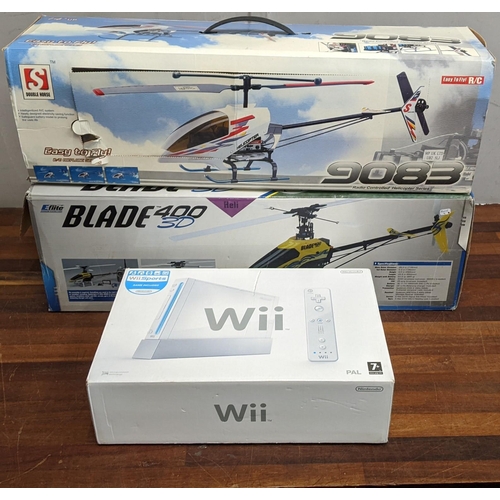 393 - Two radio controlled helicopters to include a Blade 400 3D and a Double Horse 9083, along with a Wii... 