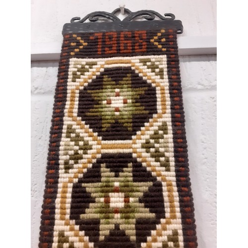 112 - A 1968 Norwegian handmade wool Klokkestreng wall hanging/traditional bell pull having a geometric de... 