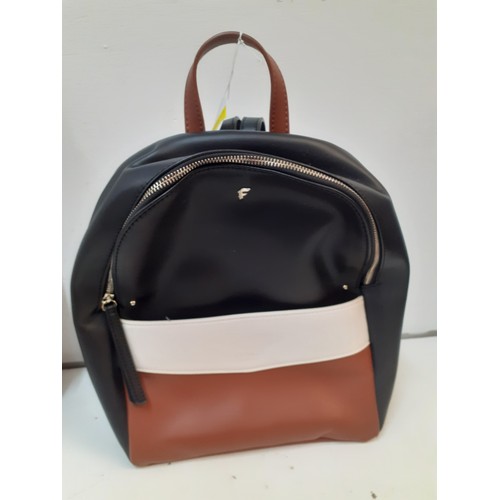 387 - Two modern fashion bags to include a Jasper Conran black patent handbag and a Fiorelli backpack. Loc... 