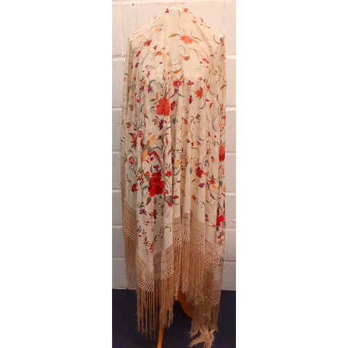 16 - A late 19th/early 20th Century crinoline shawl in cream silk with embroidered images of exotic birds... 