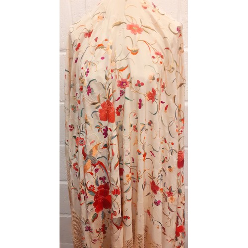 16 - A late 19th/early 20th Century crinoline shawl in cream silk with embroidered images of exotic birds... 