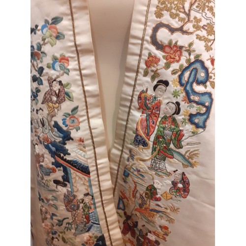 25 - Two Chinese embroidered panels on a cream silk ground, attached to create a shawl, having fine, vari... 