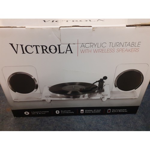 123 - A boxed Victrola acrylic turntable with wireless speakers, model no:VM-100C together with instructio... 