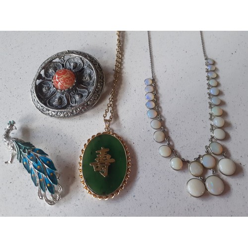 119 - A quantity of vintage costume jewellery and 2 gents watches to include a silver tone brooch with lot... 