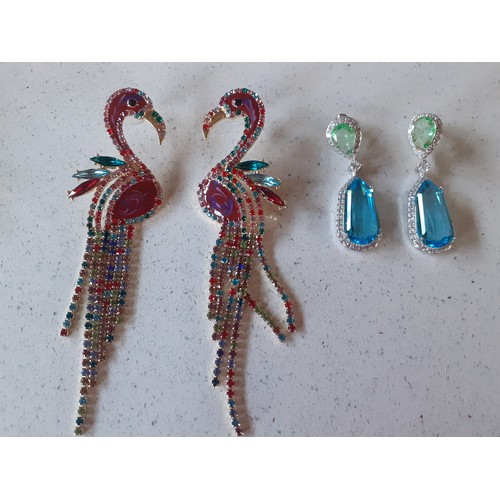 389 - A pair of over-sized coloured crystal and enamel effect earrings in the form of flamingos together w... 