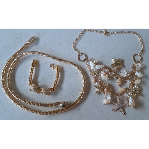 100A - Three items of modern gold tone costume jewellery comprising a snake design rope necklace with magne... 