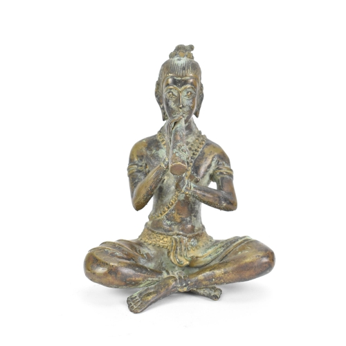 488 - A Thai bronze statue of a Buddha, in a seated cross legged position playing a musical instrument, 14... 