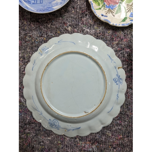 492 - Ceramics to include an 18th century Bristol Delft plate, central well depicting a figure walking in ... 