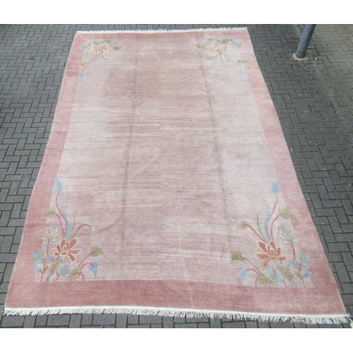 501 - A modern brown ground wool rug with floral design to each corner 485cm x 299cm Location:G
If there i... 