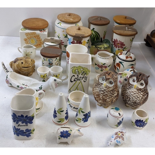 401 - A collection of Toni Raymond pottery to include lidded pots, money boxes fashioned as owl's, salt & ... 