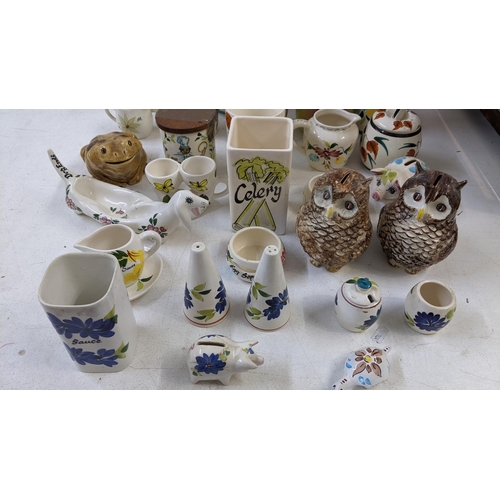 401 - A collection of Toni Raymond pottery to include lidded pots, money boxes fashioned as owl's, salt & ... 