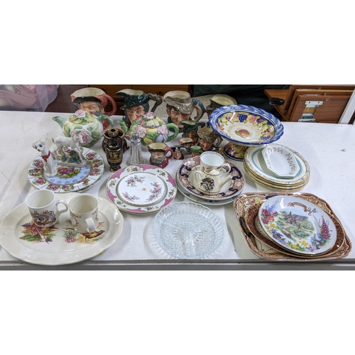 406 - A mixed lot of china and ceramics to include Toby character jugs, 19th century plates and other deco... 