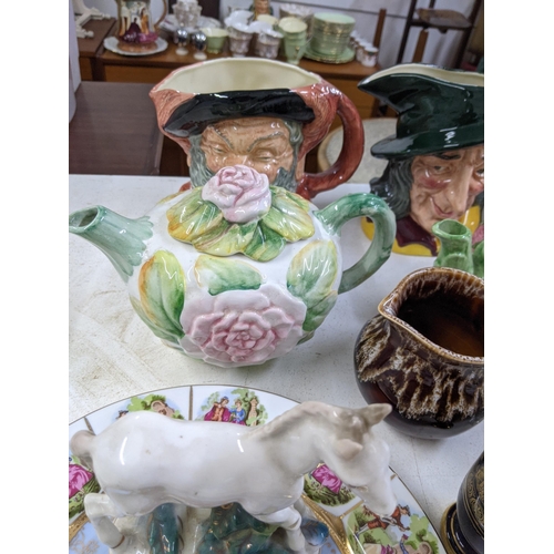 406 - A mixed lot of china and ceramics to include Toby character jugs, 19th century plates and other deco... 