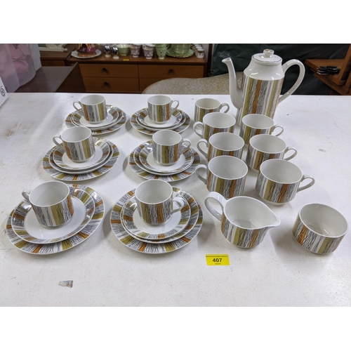 407 - A part Midwinter coffee set comprising of one coffee jug and lid, seven cups, six bigger cups, five ... 