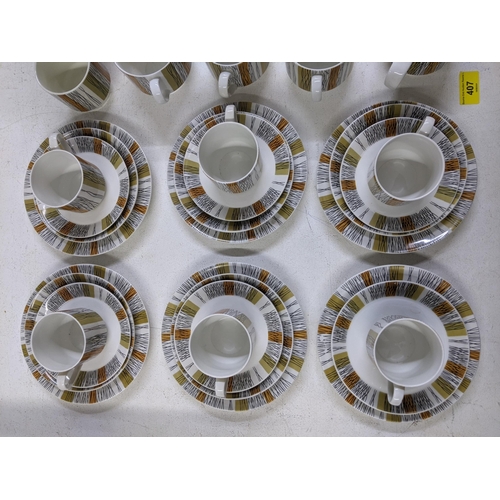 407 - A part Midwinter coffee set comprising of one coffee jug and lid, seven cups, six bigger cups, five ... 