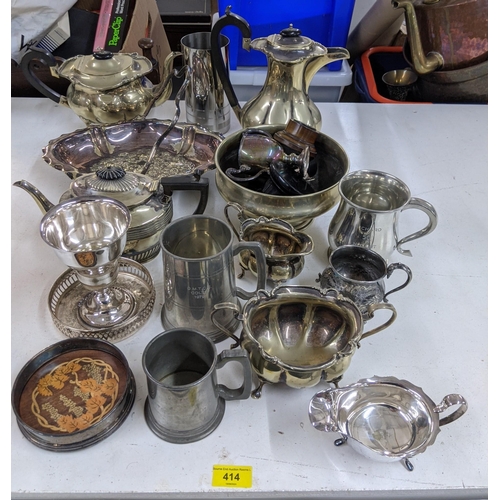 414 - Silver plated and EPNS items to include a coffee pot, tankards, teapots wine stands and other items
... 