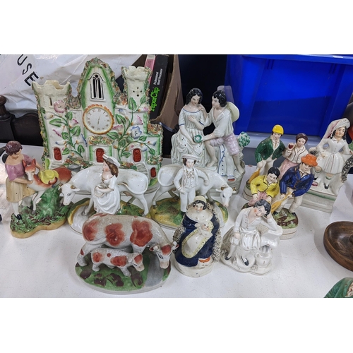 417 - A selection of 19th century and later Staffordshire ornaments to include a clock tower pastel burner... 