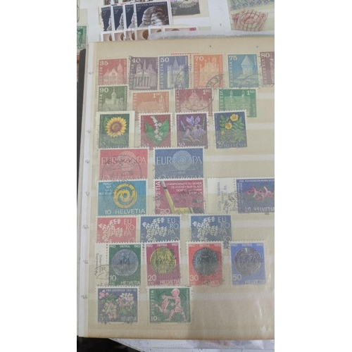 446 - A collection of part filled stamp albums from around the world to include examples from Jersey, Irel... 