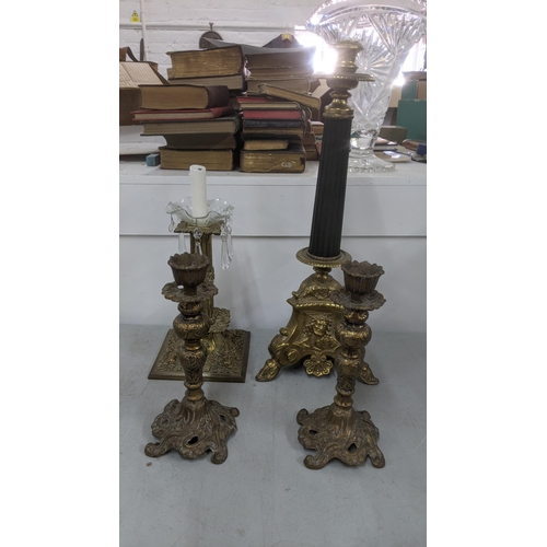 453 - Four brass candlesticks to include a 19th century ornate column example, and others
Location:10.1
If... 