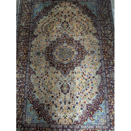 461 - A handwoven Persian rug, all over floral design with central motif, triple guard border and tasselle... 