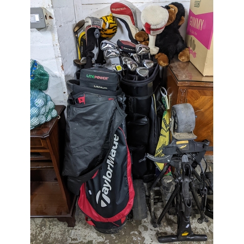 463 - Golfing equipment to include Turner, Taylor Made and RAC, and Burner golf clubs, three golf balls, a... 