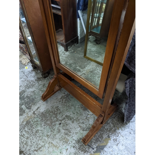 464 - A light mahogany framed cheval mirror, 165cm high Location:G
If there is no condition report shown, ... 